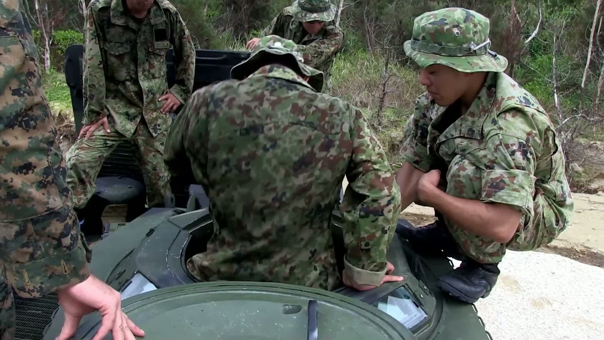 Soldiers with the Japan Ground Self Defense Force (JGSDF) and US Marines with India Company, Battalion Landing Team 3rd Battalion, 5th Marines (BLT 3/5), 31st Marine Expeditionary Unit (31st MEU) conduct an Assault Amphibian Vehicle (AAV) surf qualification on Camp Schwab, Okinawa, Japan as part of the Japanese Observer Exchange Program.  Interview by Capt. Braxton Mashburn, Commanding Officer, India Company, BLT 3/5, 31st MEU.  The JGSDF soldiers worked side-by-side with the Marines of Lima Company, BLT 3/5, 31st MEU, as part of the JOEP which consists of a wide range of bilateral events focusing on familiarization of large scale amphibious operations.