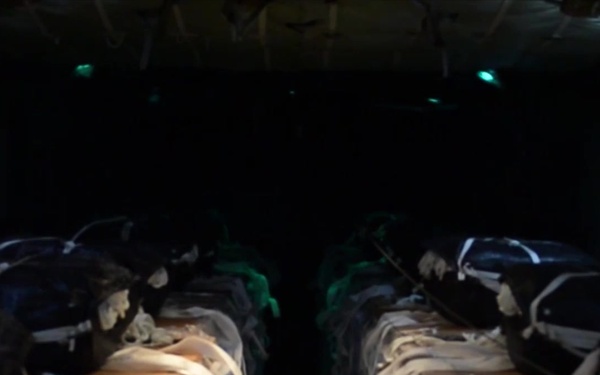 C-130 being loaded with pallets of water