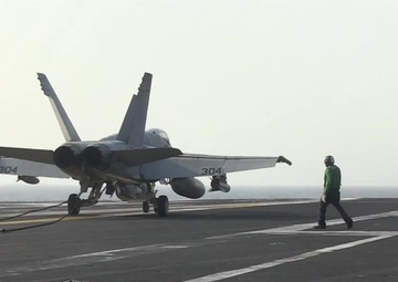 F/A-18 Hornets Land on the Flight Deck of the Aircraft Carrier USS George H.W. Bush (CVN 77)