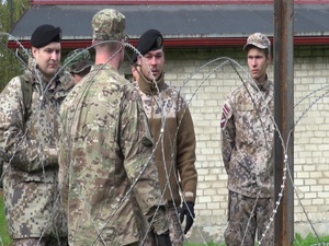 Michigan and Latvian Soldiers Show off their Military Equipment