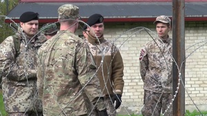 Michigan and Latvian Soldiers Demonstrate Military Equipment