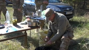 Michigan Soldiers Share Latvian Meal