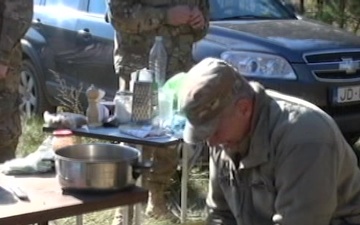 Michigan Soldiers Share Latvian Meal
