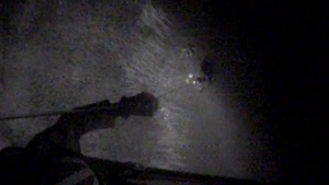 Coast Guard Aircrew Hoists Stranded Man From Marsh at Night