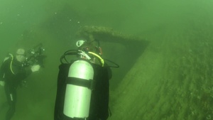 Underwater Photographer Captures Images of USS Utah Memorial