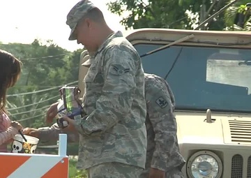 Hawaii National Guardsmen Pass Out Candy to Trick or Treaters, Patrol Neighborhoods as Lava Flow Continues