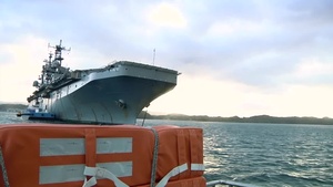 B-Roll of Sailors leaving USS Peleliu