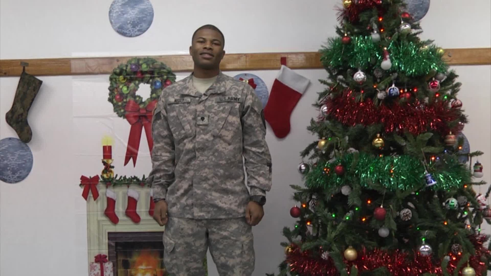 Spc. Antonio Kelly sends greetings to his family in Camden, Ark. and Anchorage, Alaska from Camp Film City, Kosovo for Holiday Season 2014.