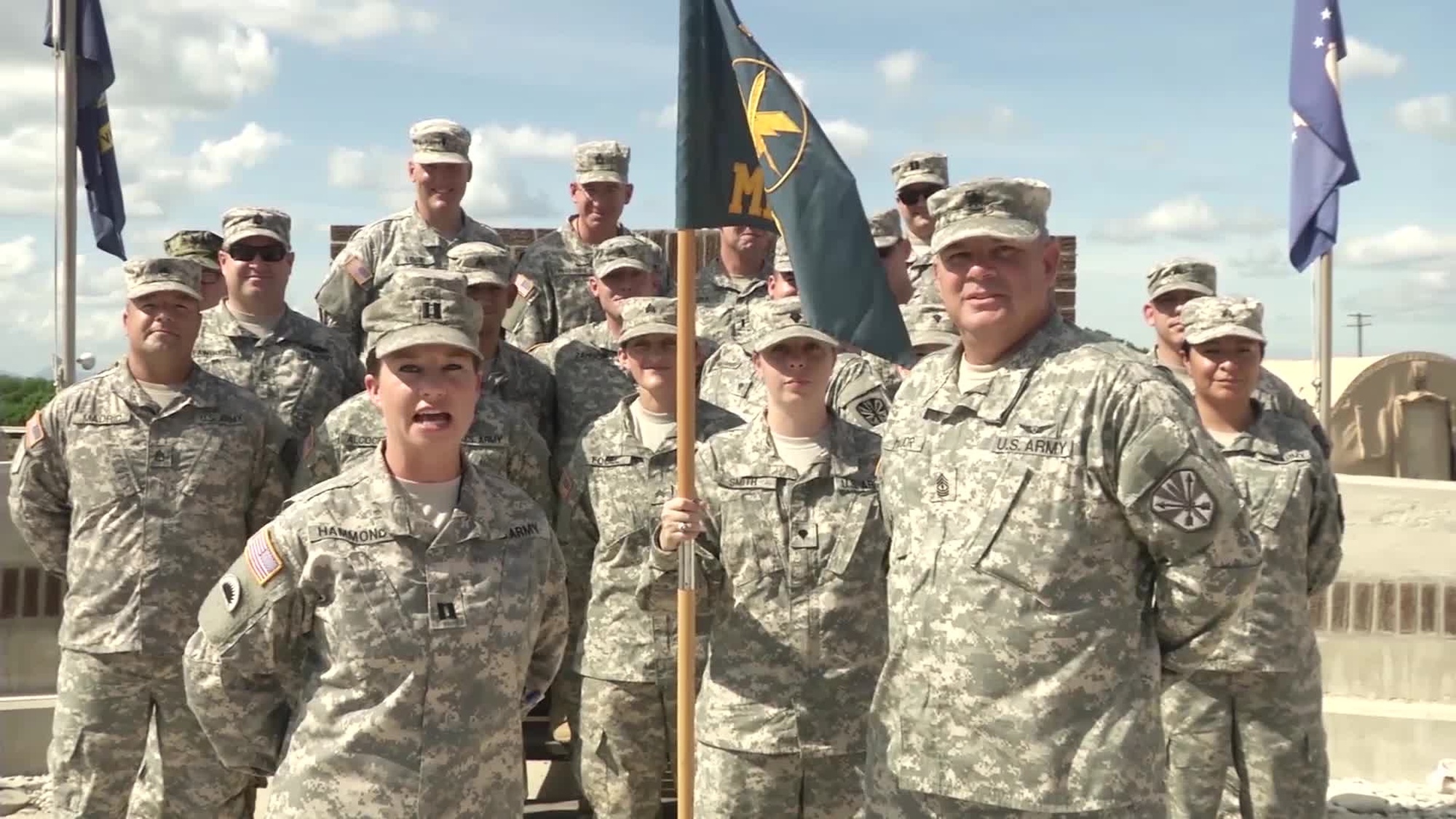 The Commander and First Sergeant of the 123rd MPAD give a holiday shout out to the Arizona Cardinals