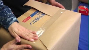 B-roll of Sailors Compiling Care Packages