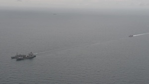 USS Fort Worth maneuvers into position behind USS Sampson and USNS Pecos to prepare for a replenishment-at-sea (B roll)