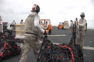 USS Essex (LHD 2) Takes On Supplies In Preparation For Operation Tomodachi