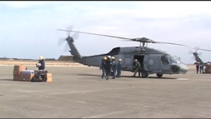 Unloading a Helicopter Sent from USS Ronald Reagan (CVN 76) in Japan Relief Effort