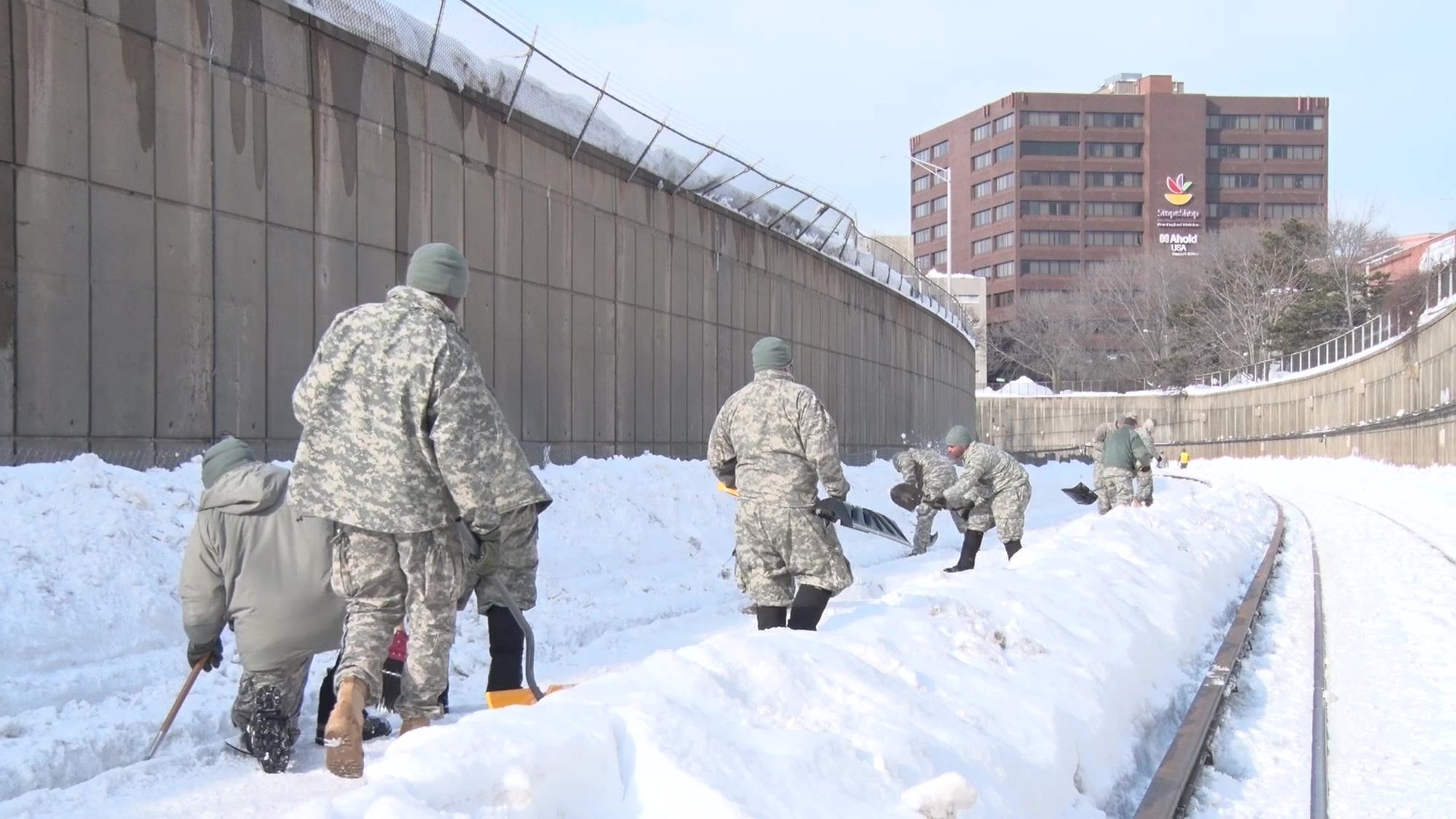 B-Roll of Soldiers from the Massachusetts Army National Guard’s 101st Field Artillery Regiment, working with the Massachusetts Bay Transportation Authority to clear snow from critical components of the Red Line subway route, outside of Quincy Center Station on February 19, 2015. Interview with 1st Lt. Lee Ford, also of the 101st FA. The soldiers were there to assist the MBTA as it struggles to keep major transportation lines functioning after record amounts of snowfall, combined with ice, have blanketed much of the tracks.