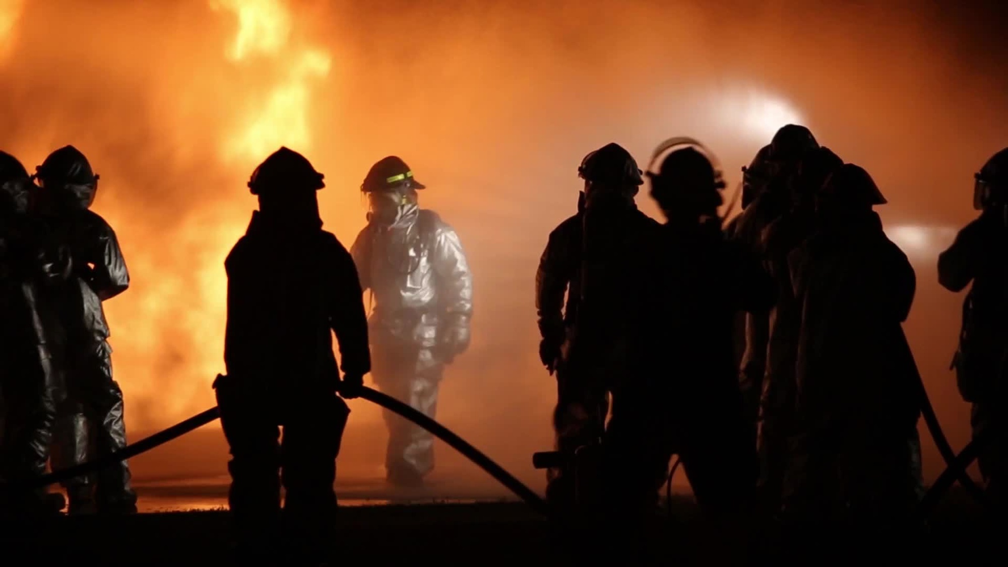 Marines assigned to Aircraft Rescue and Fire Fighting, Headquarters & Headquarters Squadron, Marine Corps Air Station Futenma, train in austere live-burn conditions, simulating a fuel fire Feb. 21, 2014. The ARFF Marines also trained Marines with Bulk Fuel Company, 9th Engineer Battalion, 3rd Marine Logistics Group, III Marine<br />Expeditionary Force in firefighting basics, instructing them on how to mitigate a fire from a distance using the five-man &quot;rain-down&quot; method before ARFF can arrive on scene. Also available in high definition.