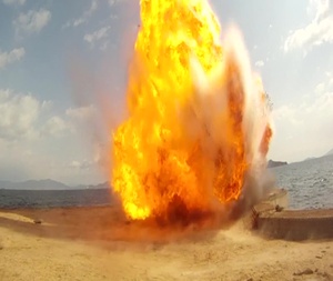 B-roll of Explosive Ordinance Disposal Technicians Get to Work Blowing Stuff Up
