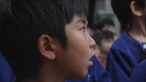 MCAS Iwakuni service members help with a Japanese elementary school graduation ceremony