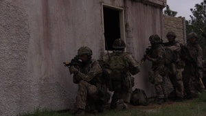 U.S. and U.K. paratroopers conduct a raid during CJOAX 15-01
