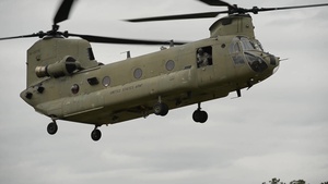 U.S and U.K. troops load CH-47 Chinooks during CJOAX 15-01