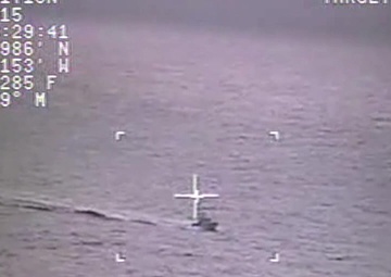 Coast Guard Rescues 3 Fishermen from Capsized Vessel, Searching for Master near Quillayute River, Wash.