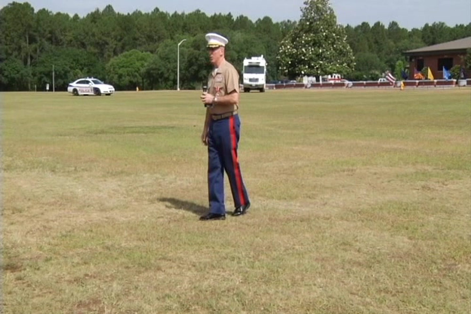Lt. Col. James C. Carroll III takes charge of Marine Corps Logistics Base Albany, Georgia, from Col. Don Davis during a change of command ceremony held at Schmid Field here, May 28, 2015.