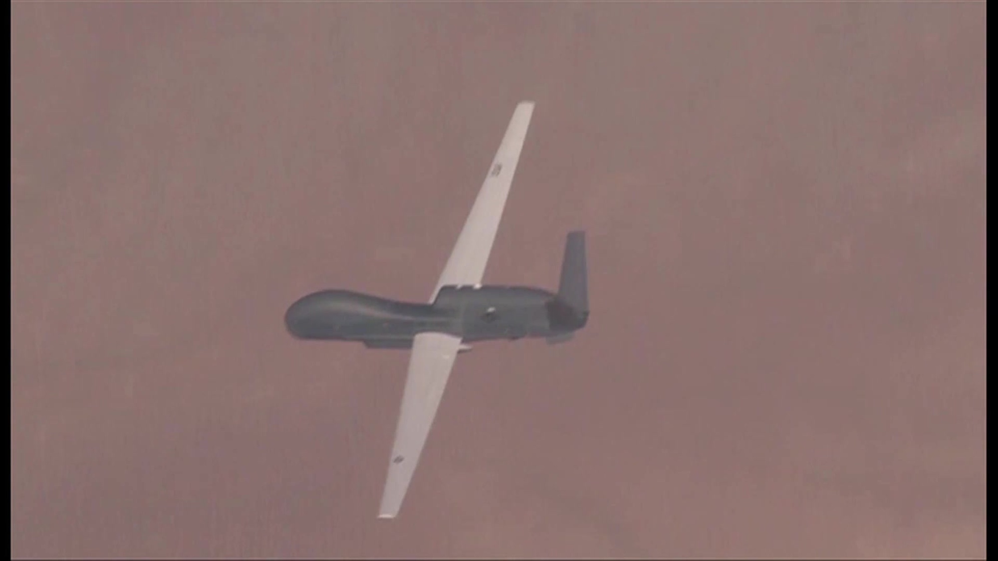 The first of NATO’s five unmanned air vehicles rolled off the factory line in San Diego on Thursday, 4 June 2015.  The Global Hawk Block 40 is part of the Alliance Ground Surveillance Program (AGS).  The NATO-owned and -operated AGS core capability will enable the Alliance to perform persistent surveillance over wide areas from high-altitude long-endurance  aircraft  in any weather or light condition . The system will give commanders a comprehensive picture of the situation on the ground.
The AGS system is being acquired by 15 Allies (Bulgaria, Czech Republic, Denmark, Estonia, Germany, Italy, Latvia, Lithuania, Luxembourg, Norway, Poland, Romania, Slovakia, Slovenia and the United States). AGS is scheduled to reach initial operational capability by the end of 2017. The air vehicles will be controlled from the main operating centre in Sigonella, Italy.