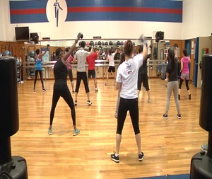 B-roll of Residents Aboard Marine Corps Air Station Iwakuni Get a Crash Course in Kickboxing at the Ironworks Gym