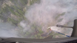 Washington National Guard pilots drop water on wildfires