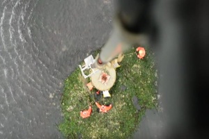 Coast Guard aircrew works ATON