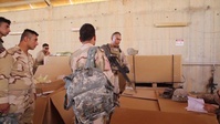Coalition members arm Iraqi 75th Brigade
