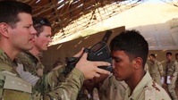 Coalition members collect Iraqi soldier biometrics information (B-roll)