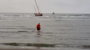 Coast Guard Crews Aid Mariners From Grounded Vessel