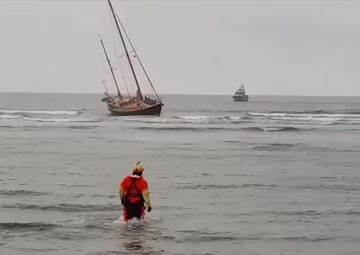 Coast Guard Crews Aid Mariners From Grounded Vessel