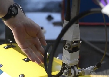Contractors Prepare Tow Ping Locator Aboard USNS Apache