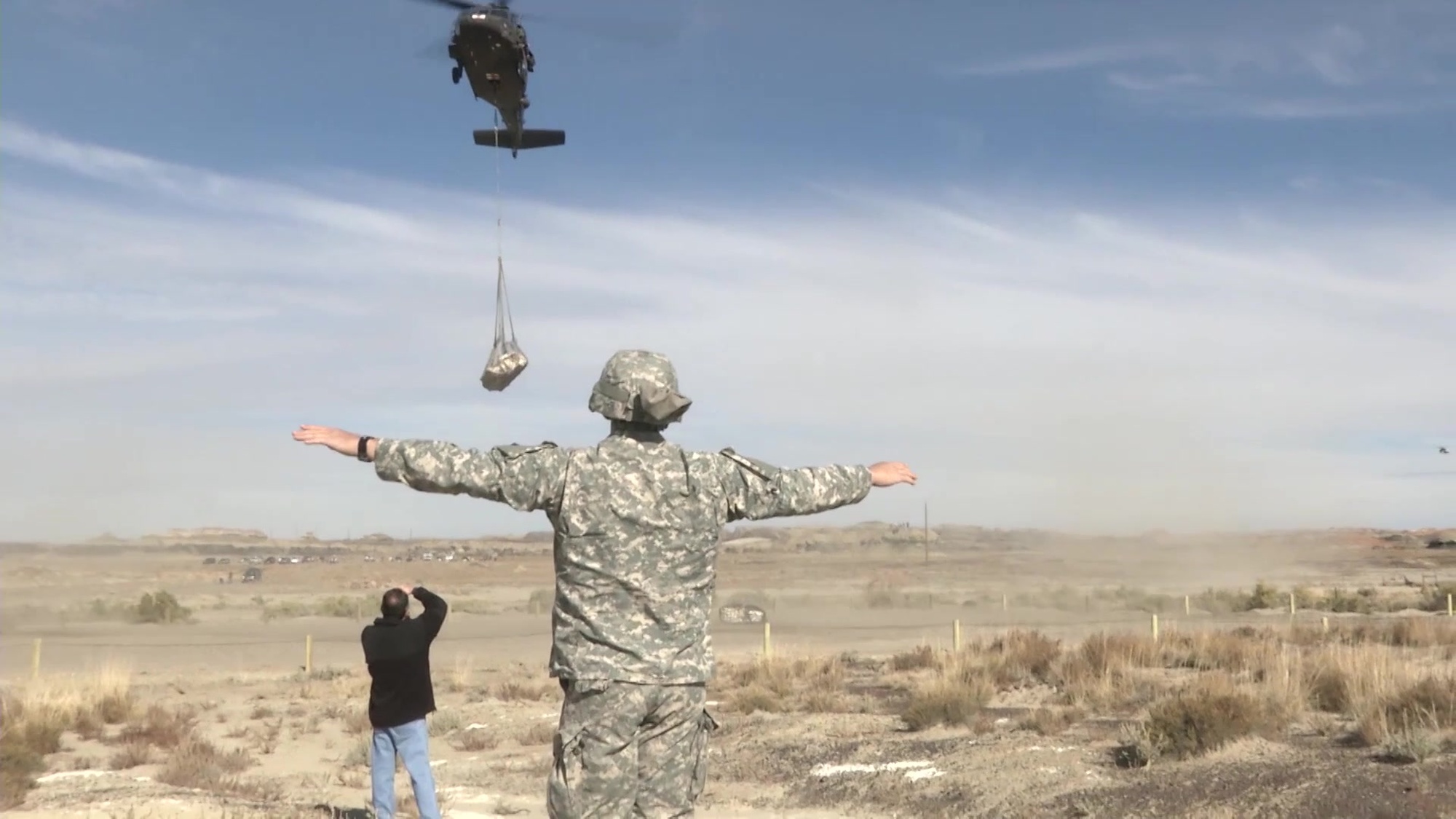 Pentaceraops Ops in cooperation with the New Mexico Museum of Natural History and Science, Bureau of Land Management and Department of Cultural Affairs the New Mexico Army National Guard conducted preparation of and sling load lift of dinosaur fossils.<br />Sgt. Joshua Cunningham, Company B, 1st Battalion, 200th Infantry guides in the second dinosaur fossil sling load from the Ah-she-sle-pah site. (Released, video by Sgt. Zack Freeman, 200th PAD)