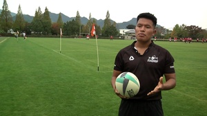 Rockets play alongside their Japanese counterparts in the game of rugby