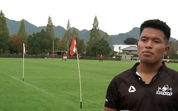 Rockets play alongside their Japanese counterparts in the game of rugby