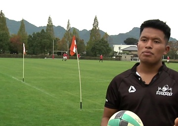 Rockets play alongside their Japanese counterparts in the game of rugby