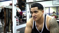 Bodybuilder pumps iron for upcoming competition