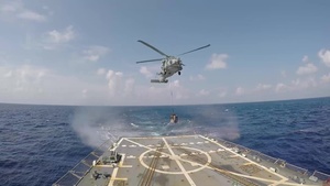 A U.S. Navy MH-60R Seahawk Helicopter Hauls Cargo