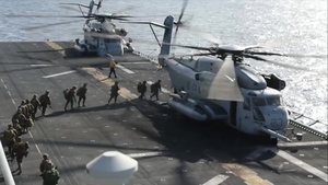 Marines Boarding a CH-53 Sea Stallion onboard USS Boxer (LHD 4)