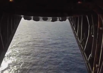 HC-130 Hercules Airplane Crew Drops Equipment to Crew who Abandoned Ship South of Hawaii