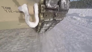 Marine M1A1 tanks slide on Norwegian ice track