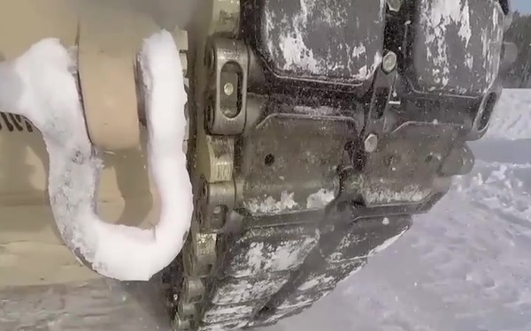 Marine M1A1 tanks slide on Norwegian ice track