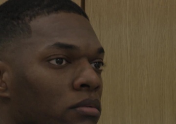 B-Roll of Dana Urbanek holding a credit, debt management class