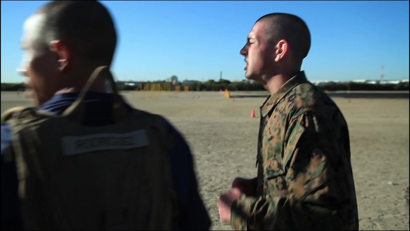 A recruit from Mike Company, 3rd Recruit Training Battalion, applies a choke  hold during a Marine Corps Martial Arts Program test at Marine Corps  Recruit Depot San Diego, July 20. The recruits