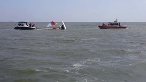 Coast Guard, Coast Guard Auxiliary rescues boater off overturned catamaran near Bolivar Galveston Jetty