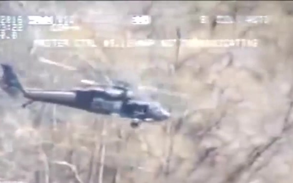 La. National Guard Black hawk dropping sling-loaded sand bags southeast of Colfax, La. in Bayou Rigolette.