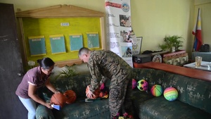 CJCMOTF COMREL Cmdr. Robert Christian Donates Sports Equipment to Local Schools