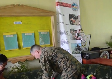 CJCMOTF COMREL Cmdr. Robert Christian Donates Sports Equipment to Local Schools